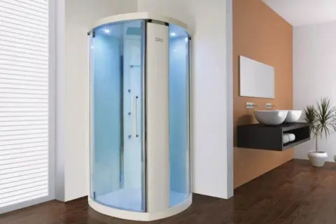Une cabine de douche moderne avec éclairage bleu, offrant une expérience de douche sensorielle relaxante.